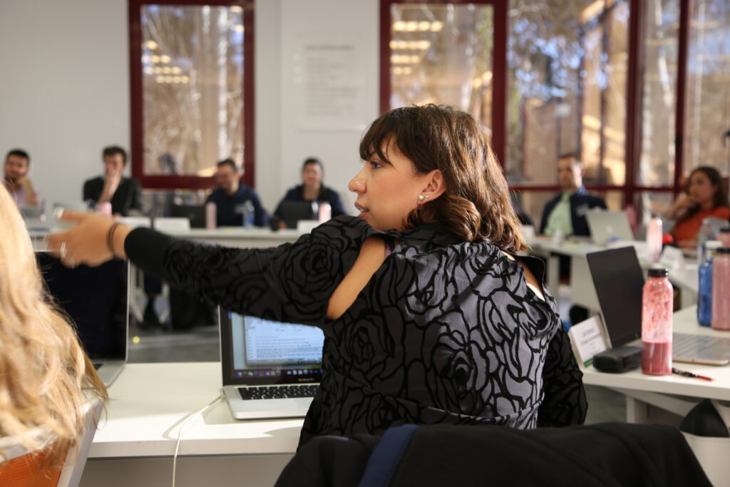 Woman building onto a classmates point