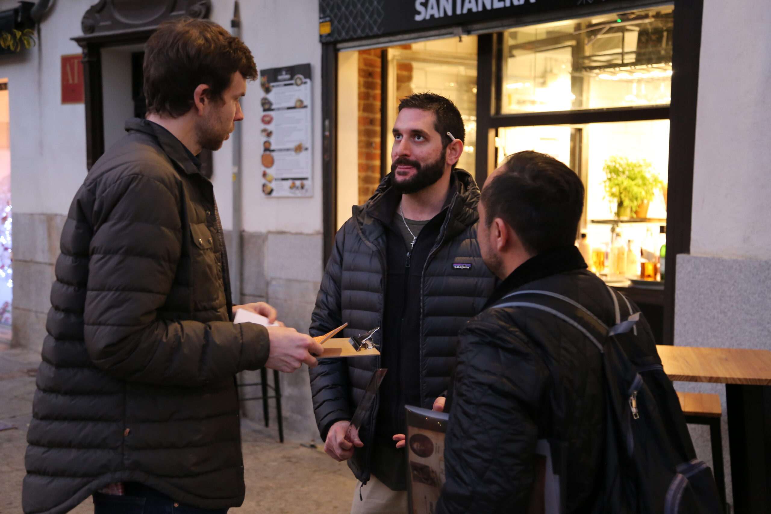 Three men talking